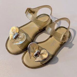 Brand New Gold Mini Melissa Mini Mar x Barbie Collab size 13